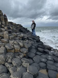 Standing at Giants Causeway in Northern Ireland